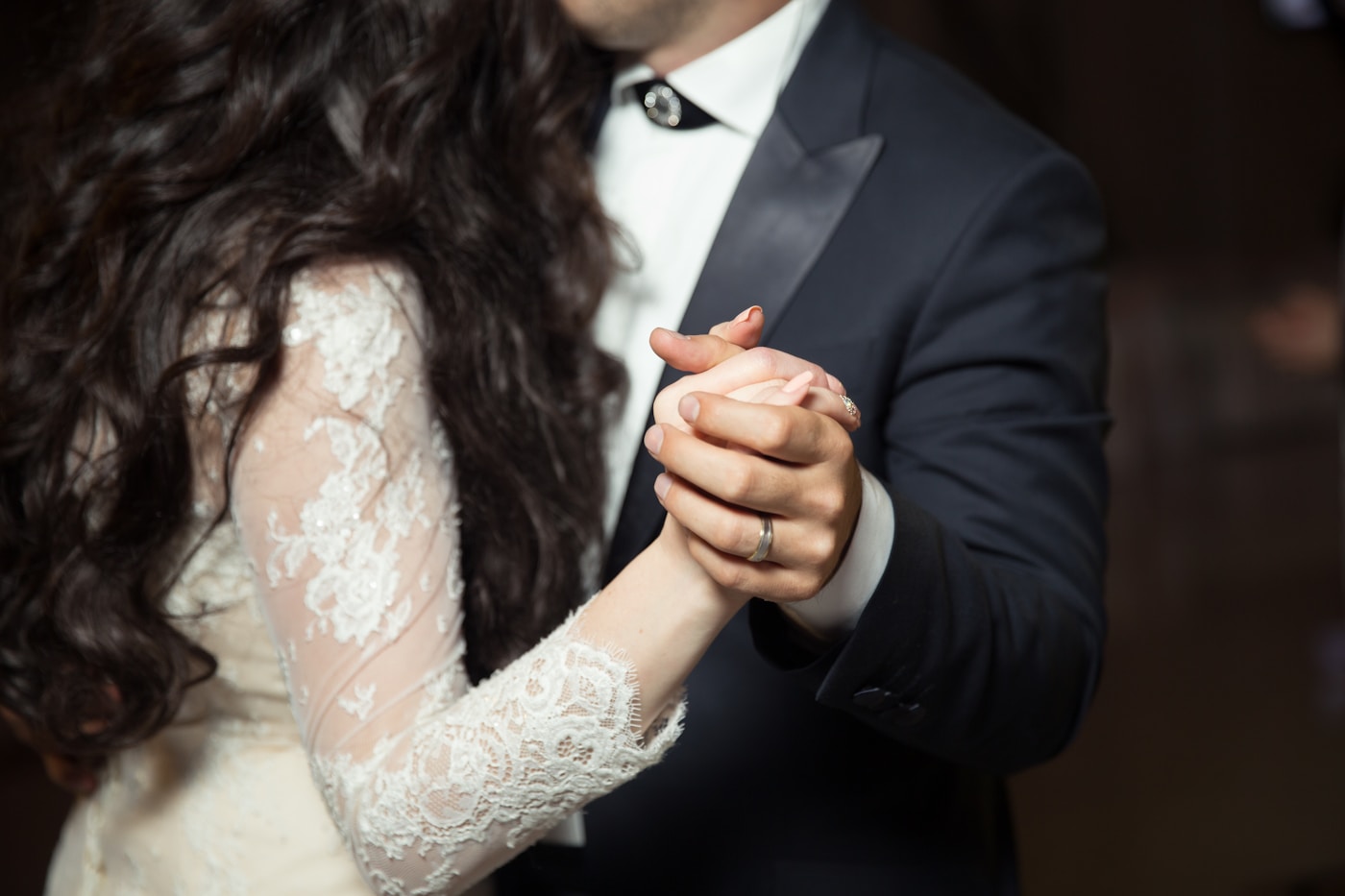 A couple dancing closely at their wedding